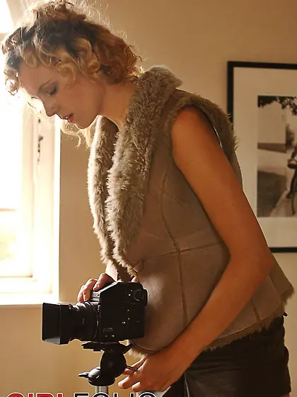 Blonde chick with curly hair takes erotic photos of herself whil