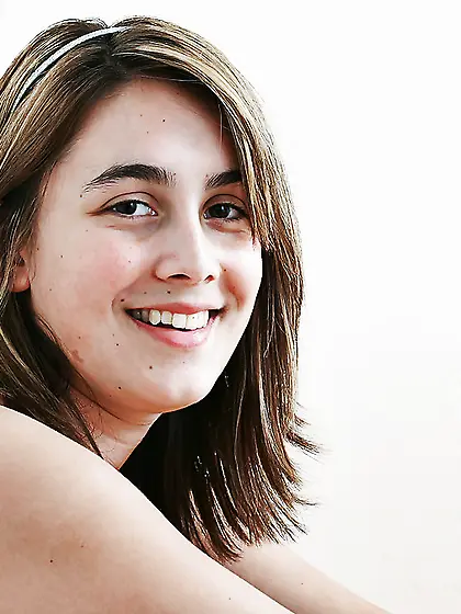 Barely legal babe takes it all off to show her natural breasts