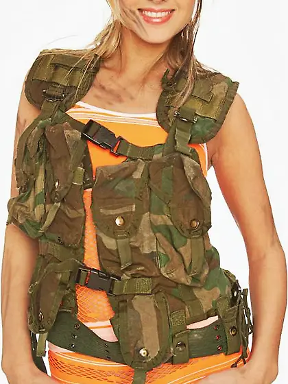 Lovely blond minx removes military vest to pose naked in army bo