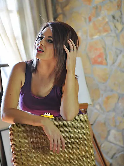 Brunette doll Sarah Saint goes into the playful mood and strips