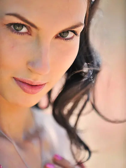 Brunette in sexy lingerie showcasing her body and beautiful boob