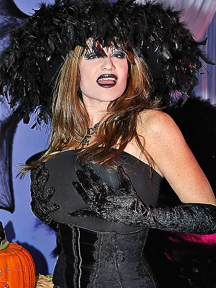 Busty blonde witch Kelly Madison takes off her black dress and s