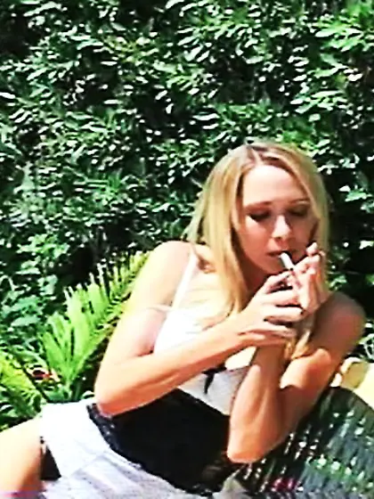 Great blonde lady smokes
