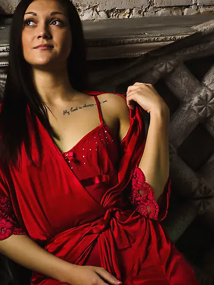 Tattooed brunette red dress