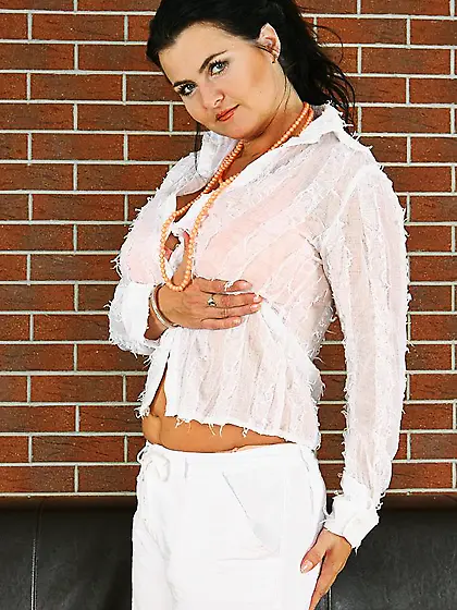 Curvy brunette MILF Reny Karups shows off her gigantic titties a