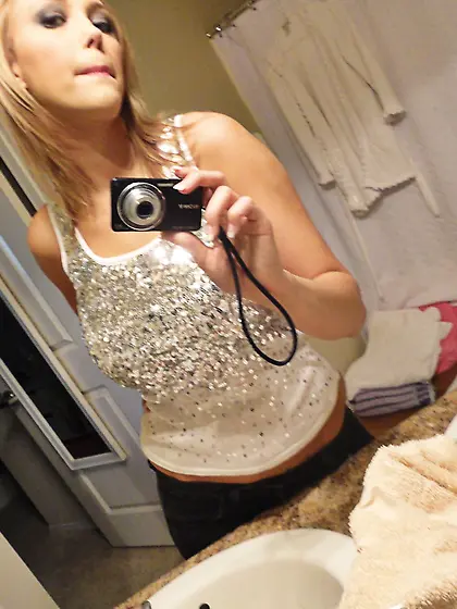 Busty blonde lady takes off her lingerie, spreads long legs, str