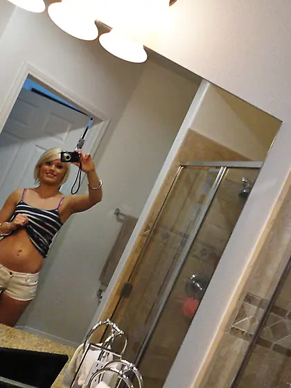 This short haired darling with small boobies shows her body and