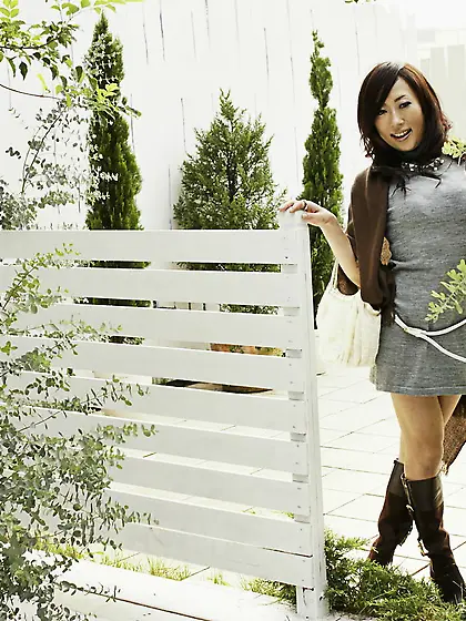 Sexy oriental love in a pretty seductive dress poses outdoors an