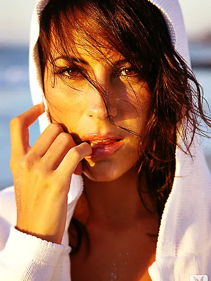 Erika Michelle Barre enjoys a walk on a beach to swim and to pos