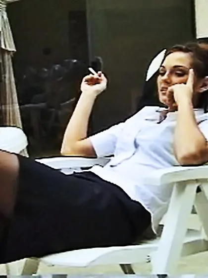 Hot brunette gal enjoys a nice cigarette...