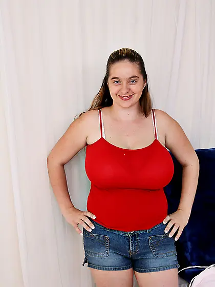 Chubby BBW slut April Mckenzie strips on the sofa and slurps on