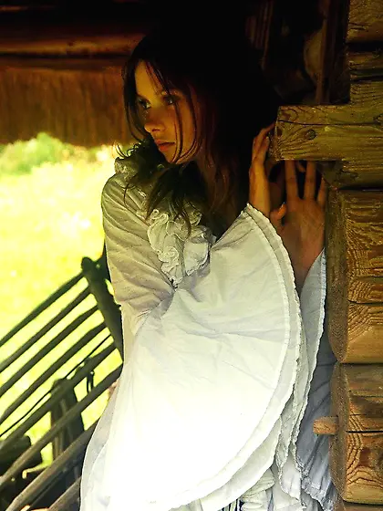 Alluring brunette with a bush showing her body in a retro-inspir