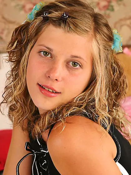 Bimbo chick with nice boobs provocatively undresses being alone