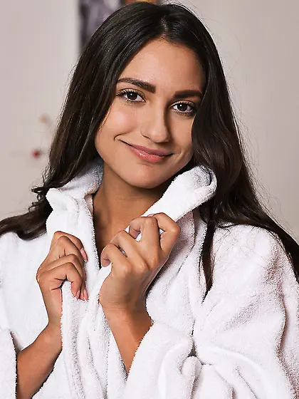 Magnetic brunette wearing white