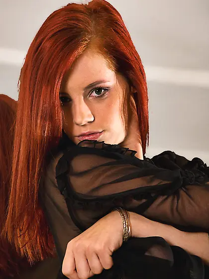 Beautiful classy redhead Gabrielle Lupin teases us in sexy black