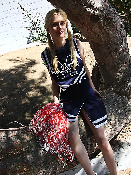Pornstar Kennedy Kressler in a cheerleader suit is drilled by a