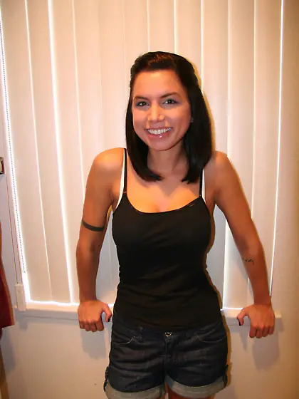 Short-haired brunette snapping naked selfies in the bathroom