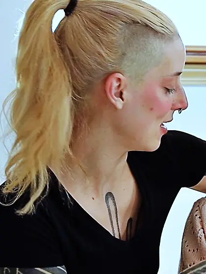 Submissive tattooed blonde spanked