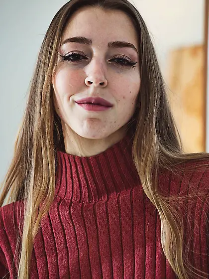 Mary Popiense enjoys stripping down to her sweater