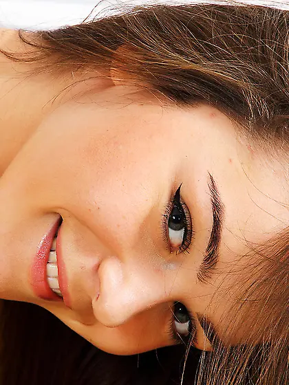 Young girl Lily C got on the sofa nude and spread her legs to sh