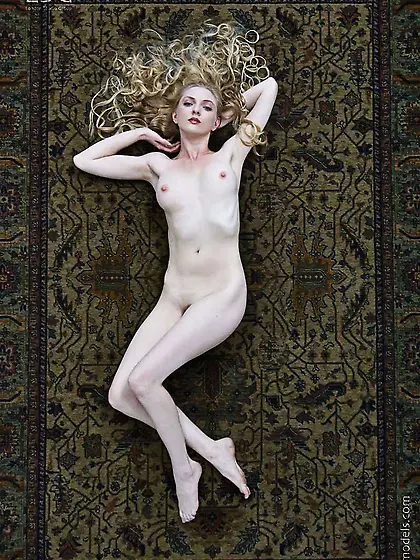 Pale skinned model Tiana Hunter with long blonde hair in all her