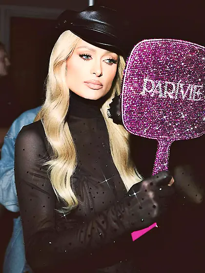 Paris Hilton in a sheer black top