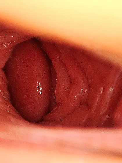 Ponytailed chick in a sexy skirt fisting her own slit on the flo