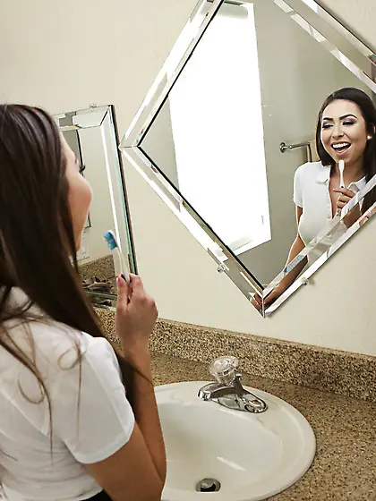 Dark-haired,  round-faced schoolgirl getting spanked and banged