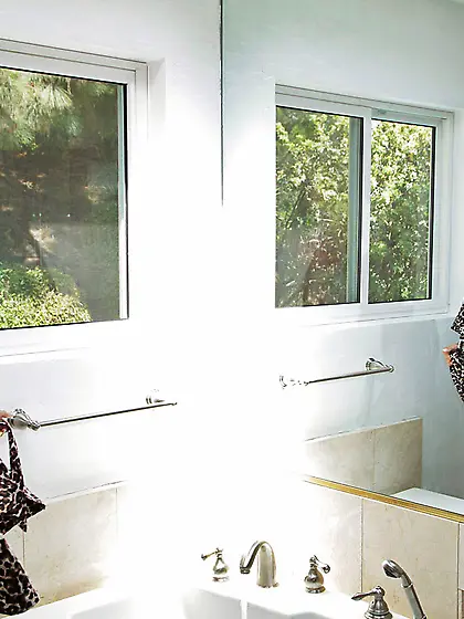 Beautiful blonde gal Erica Fontes strips her pink thongs and sho