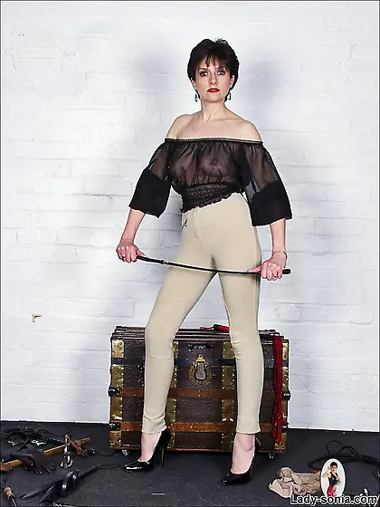 Lady Sonia takes her tight pants off and teases us with her hung