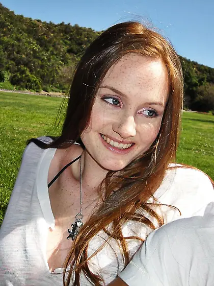 Pale skinned redhead Holly Hanse has dick between her tits then