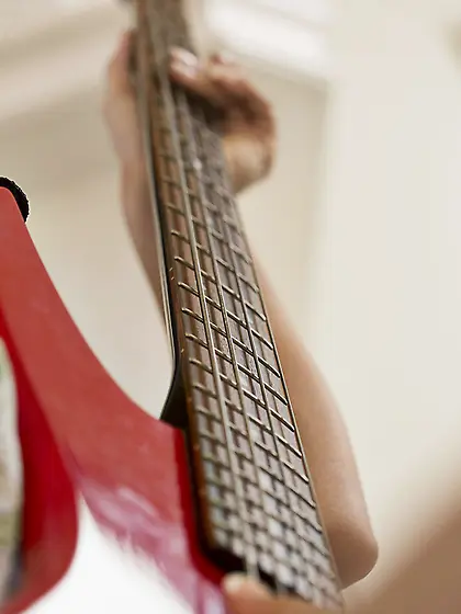 Curly-haired and exotic-looking beauty takes off her denim short