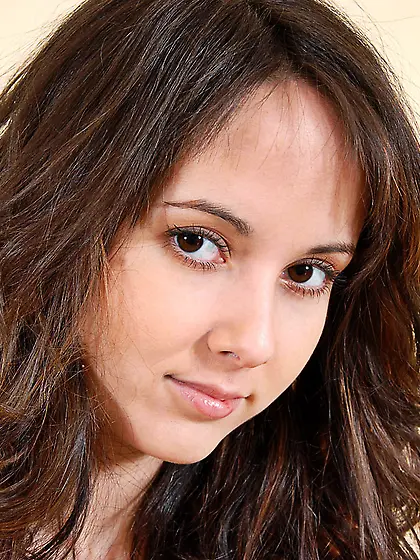 Smoking hot brunette gal Angel Kiss strips her red pants and sho