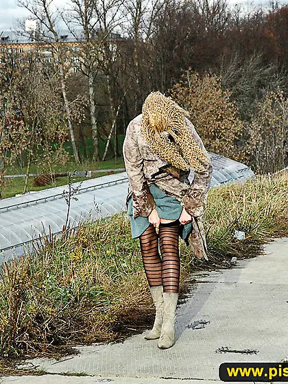 Teen walking and pissing outdoor