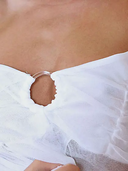 Peaches strips her little panties off on the sofa and plays with