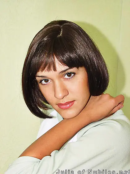 Tanned teenage hottie Julia Nubiles playfully unwraps her gorgeo