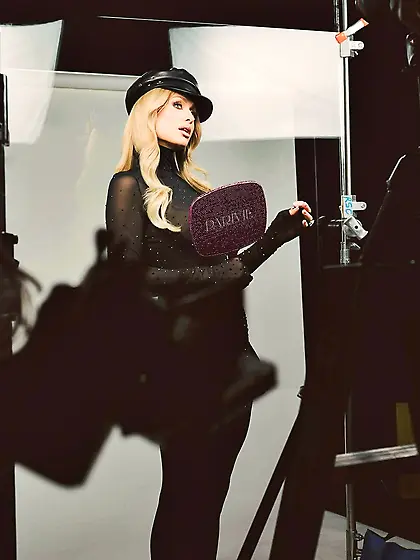 Paris Hilton in a sheer black top