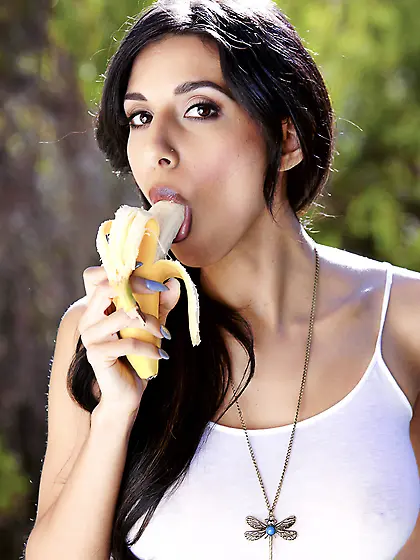 Denim shorts brunette eating a banana before masturbating outdoo