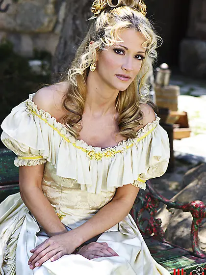 Blondie in a hot outfit is playing with her pussy while outside