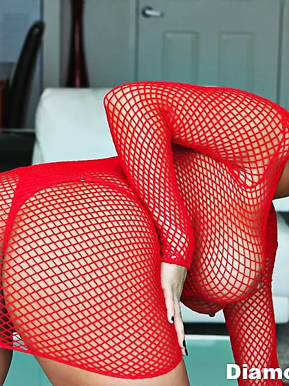 Big breasted babe Diamond Kitty strips her red fishnet bodystock