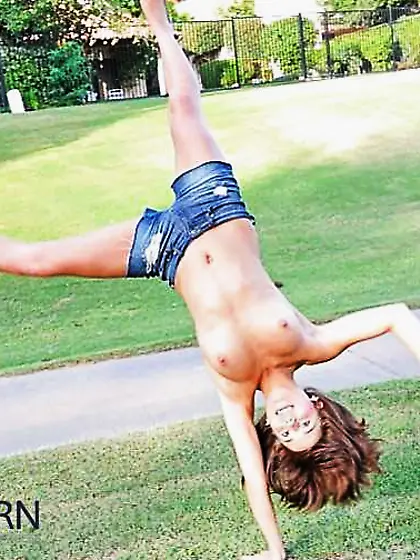 Teenager black-haired showing in the park by Sail