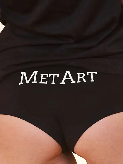 Brunette beauty dressed in black ends up completely naked on a b