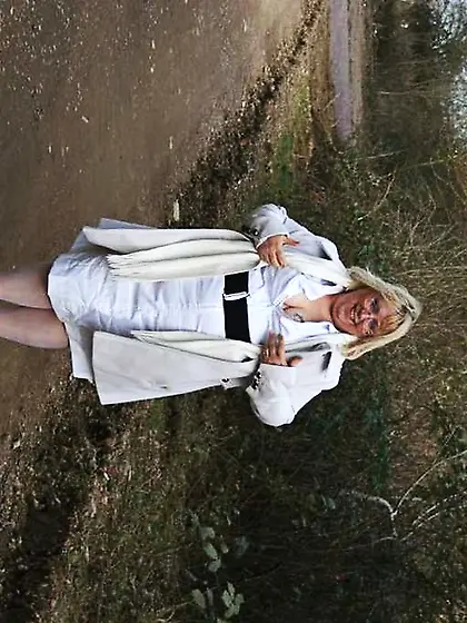 Blonde granny displays size