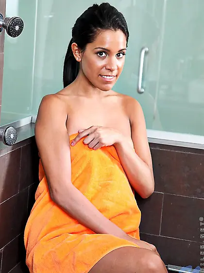 Black haired tight latina chick Alana G touches her smooth pussy