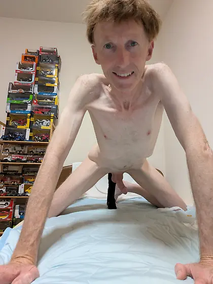 Me wearing various kink masks and fox tail butplug