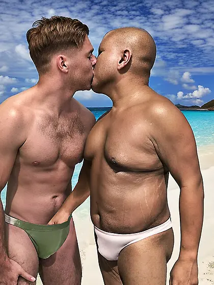 Kissing at the beach in our bikinis