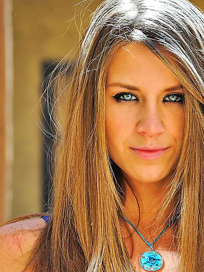 Perfect girl in a purple dress showing off that insane body for