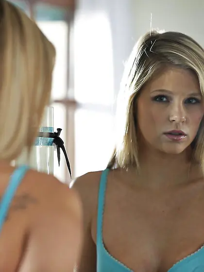 Awesomely beautiful blonde babe Scarlet Red is undressing and ex