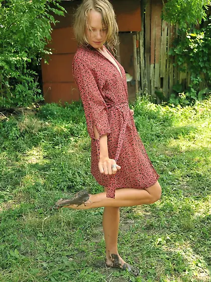 Young girl with wet hair showing off while exploring the country
