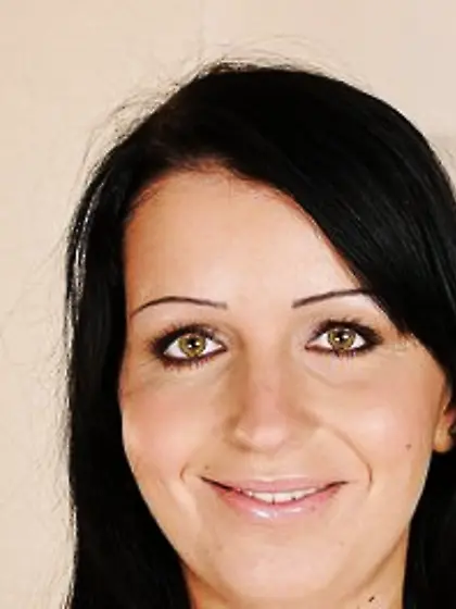 Tempting black-haired girl slowly doffs clothes to reveal her se